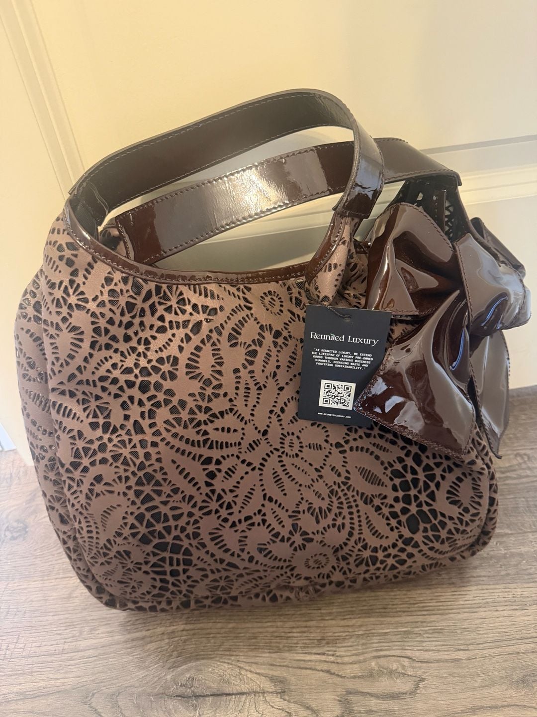 Valentino Garavani Laser-Cut Floral Pattern Brown Leather Handbag With Bow Detai